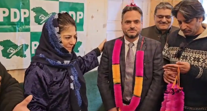 Adv. Haq Nawaz Chowdhary being garlanded by PDP chief Mehboooba Mufti on joining the party